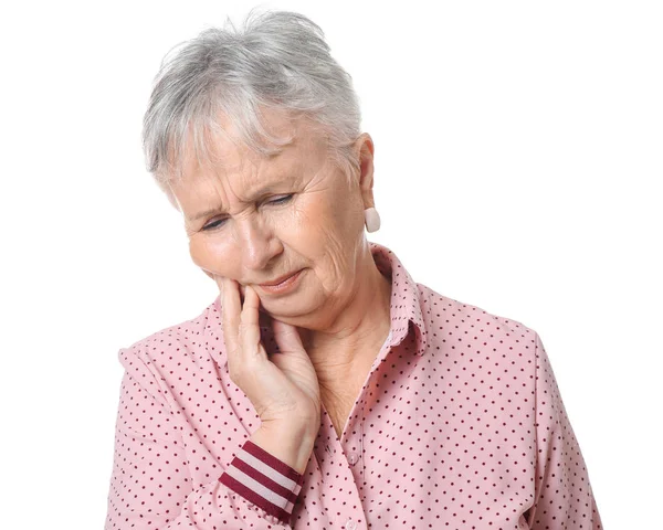 Senior woman suffering from toothache on white background — Stock Photo, Image