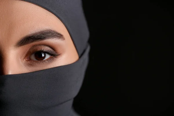 Beautiful Arab woman on dark background, closeup — Stock Photo, Image