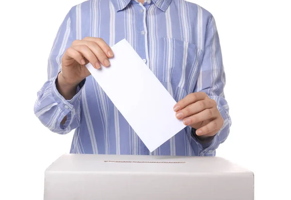 Woman putting ballot paper in voting box against white background — Stock Photo, Image