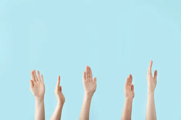 Hands of voting people on color background — Stock Photo, Image
