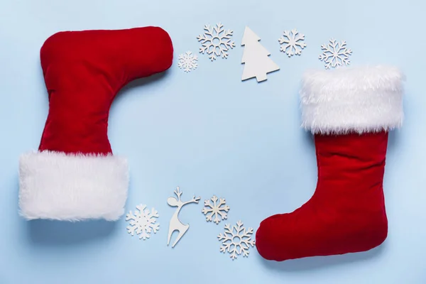 Christmas socks with decor on color background — Stock Photo, Image