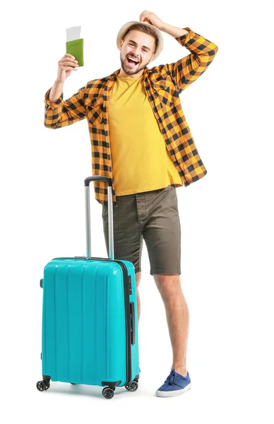 Young male tourist with luggage on white background — Stock Photo, Image