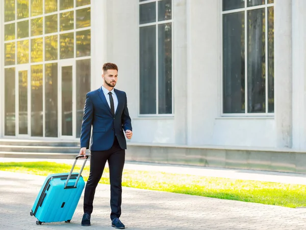 Young man with luggage for business trip outdoors — Stock Photo, Image