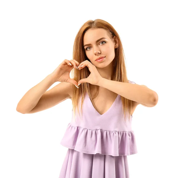 Beautiful young woman making heart with her hands on white background — Stock Photo, Image