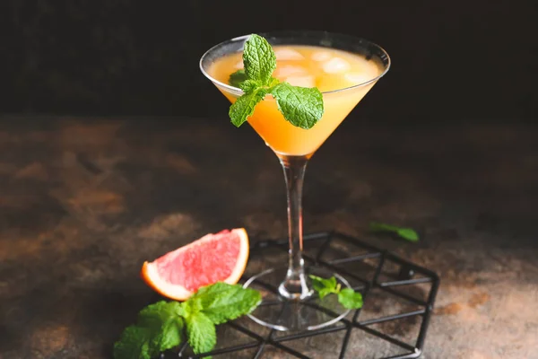 Glass of fresh citrus juice on table — Stock Photo, Image