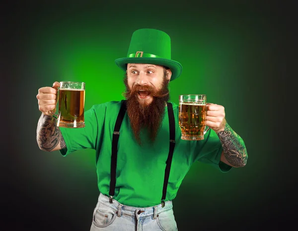 Bearded man with glasses of beer on dark background. St. Patrick's Day celebration — 스톡 사진