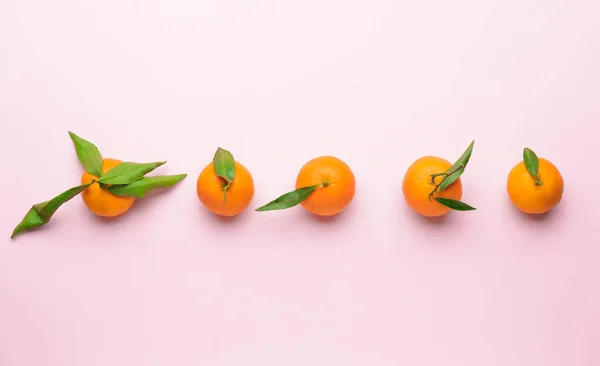 Sweet tangerines on color background — Stock Photo, Image