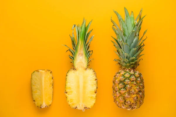 Fresh ripe pineapples on color background — Stock Photo, Image