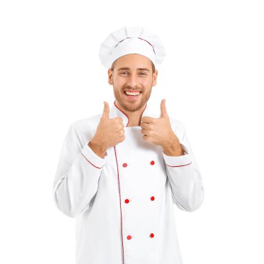 Yakışıklı erkek şef beyaz arka planda baş parmak hareketi yapıyor.