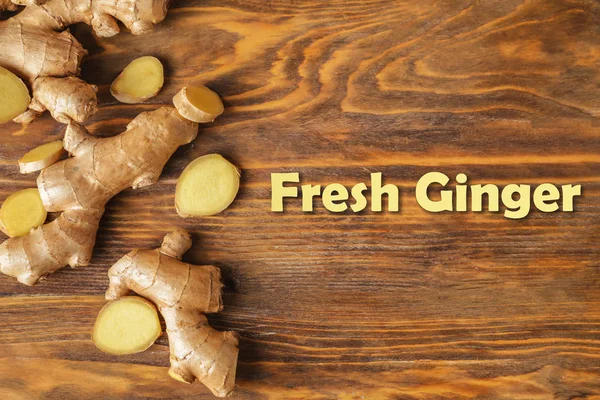 Fresh ginger on wooden table — Stock Photo, Image