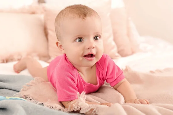 Portrait of cute little baby on bed at home — Stock Photo, Image