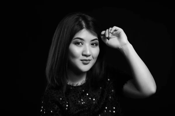 Black and white portrait of young Asian woman on dark background — Stock Photo, Image