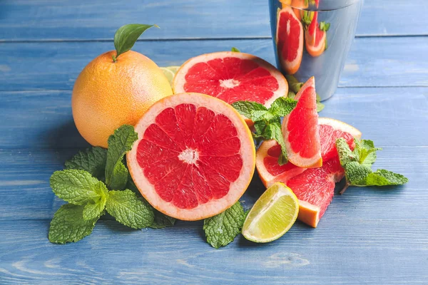 Fresh grapefruits and lime on table — Stock Photo, Image