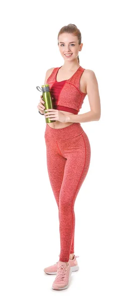 Mujer joven deportiva con botella de agua sobre fondo blanco —  Fotos de Stock