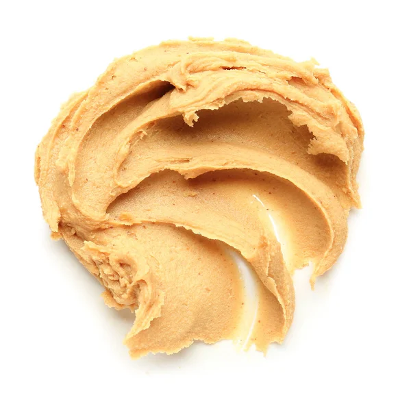 Вкусное арахисовое масло на белом фоне — стоковое фото