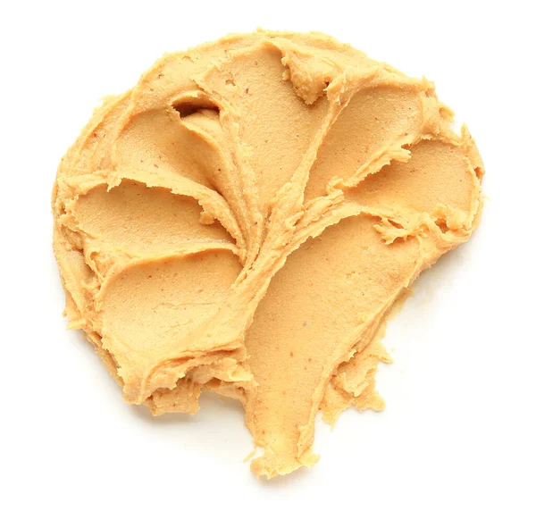 Leckere Erdnussbutter auf weißem Hintergrund — Stockfoto