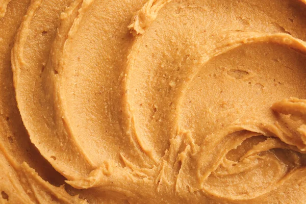 Leckere Erdnussbutter als Hintergrund — Stockfoto