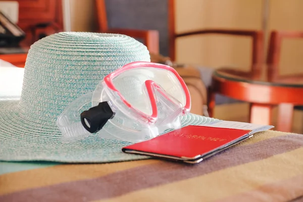 Snorkeling mask, hat and documents in room. Travel concept — Stock Photo, Image