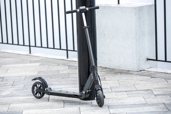 Modern electric kick scooter outdoors — ストック写真