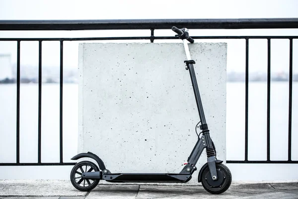 Modern electric kick scooter outdoors