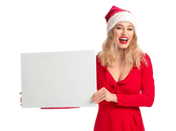 Mulher bonita em chapéu de Santa e com banner em branco no fundo branco — Fotografia de Stock