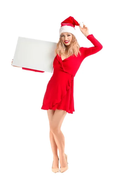 Beautiful young woman in Santa hat and with blank banner on white background — Stock Photo, Image