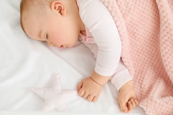 Cute sleeping little baby in bed — Stock Photo, Image