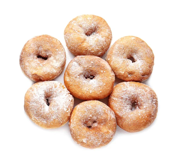 Süße leckere Donuts auf weißem Hintergrund — Stockfoto