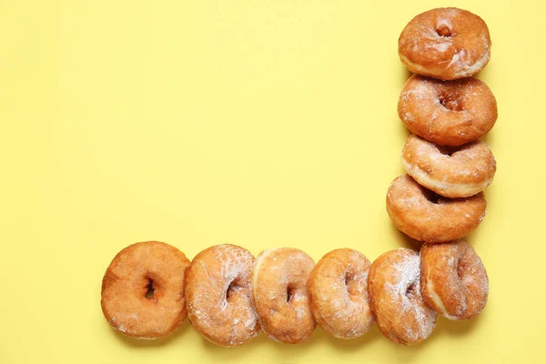 Sweet tasty donuts on color background — Stock Photo, Image