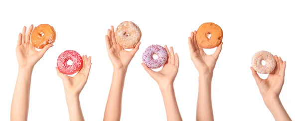 Female hands with sweet donuts on white background — Stock Photo, Image