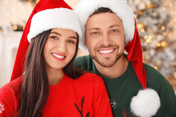 Happy couple on Christmas eve at home — Stock Photo, Image