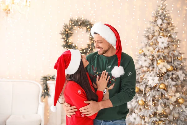 Happy couple on Christmas eve at home — Stock Photo, Image