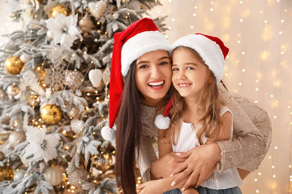 Happy mother with little daughter on Christmas eve at home — Stock Photo, Image