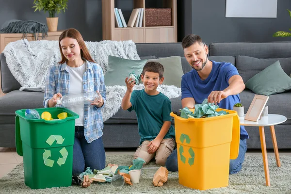 Family sorting garbage at home. Concept of recycling — Stock Photo, Image