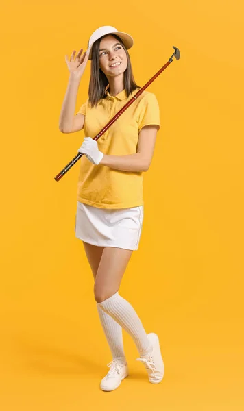 Beautiful female golfer on color background — Stock Photo, Image