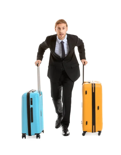 Young businessman with luggage isolated on white — Stock Photo, Image