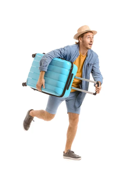 Спешащий турист с багажом изолирован на белом — стоковое фото