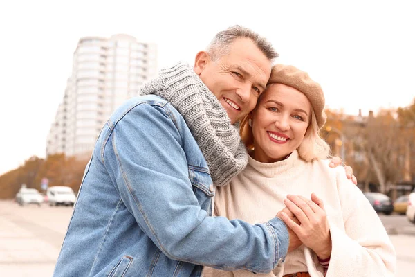 Portrait of happy mature couple outdoors on autumn day — Stock Photo, Image