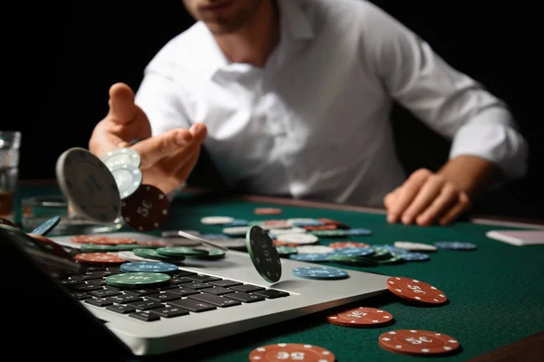 Young man playing poker online, closeup — Stock Photo, Image