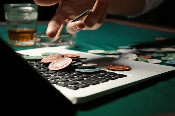 Young man playing poker online, closeup — Stock Photo, Image