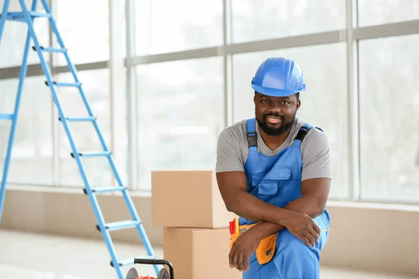 Portrait of African-American electrician in room — Stock Photo, Image