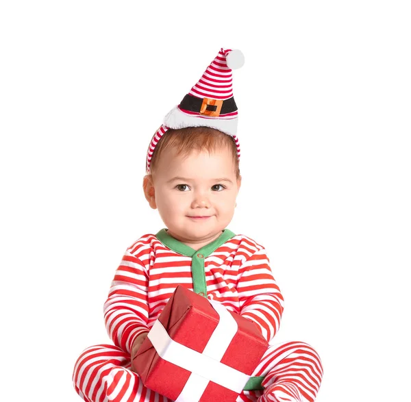 Cute little baby with Christmas gift on white background — Stock Photo, Image