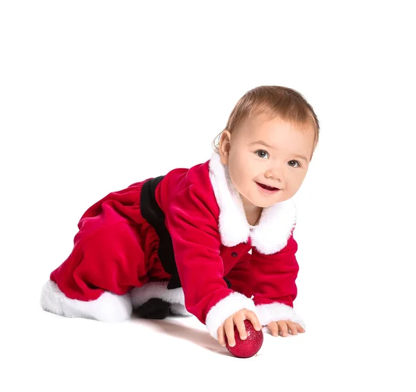 Cute little baby in Santa Claus costume and with Christmas ball on white background — Stock Photo, Image