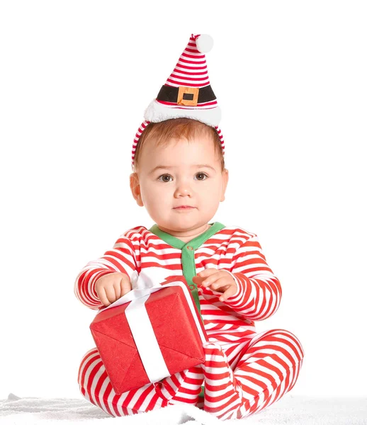 Cute little baby with Christmas gift on white background — Stock Photo, Image