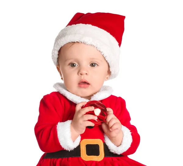 Cute little baby in Santa Claus costume and with Christmas ball on white background — Stock Photo, Image