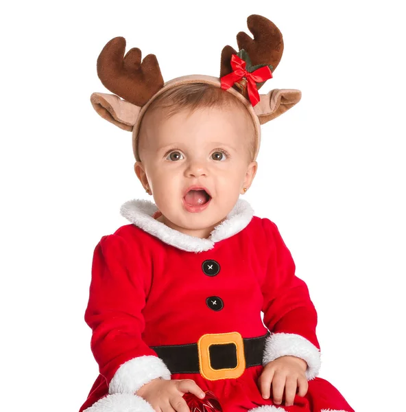 Cute little baby in Santa Claus costume and deer horns on white background — Stock Photo, Image