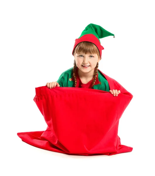 Menino elfo sentado no saco de Papai Noel no fundo branco — Fotografia de Stock