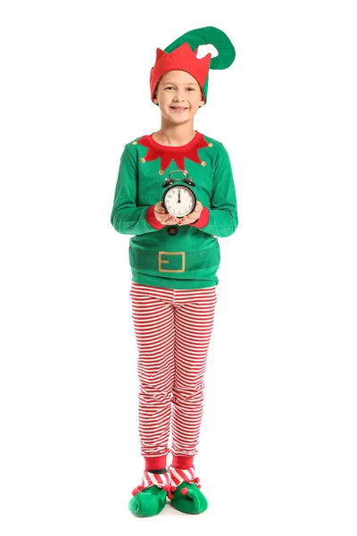 Niño en traje de elfo y con despertador sobre fondo blanco —  Fotos de Stock