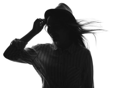 Beyaz arka planda güzel genç bir kadının silueti.