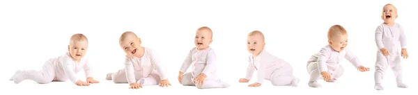 Lindo bebé aprendiendo a caminar sobre fondo blanco —  Fotos de Stock
